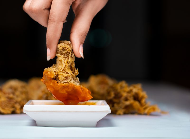 Nashville Fire hot chicken tenders with cayenne coating